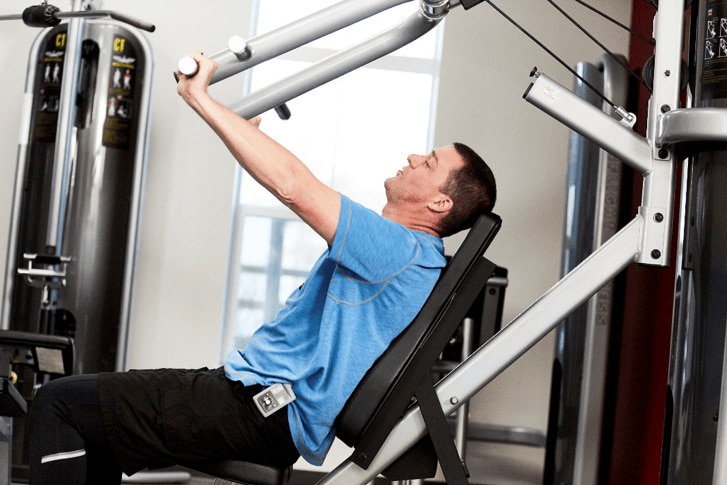 man exercising in gym