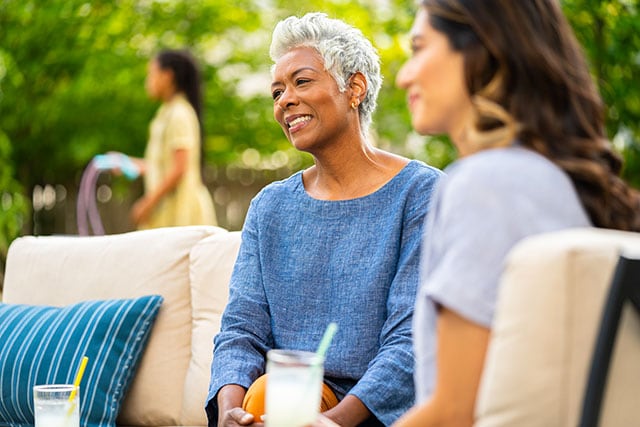 Image of two women sitting down