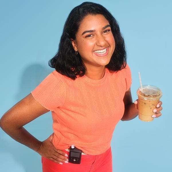 MiniMed Champion Samira holding coffee