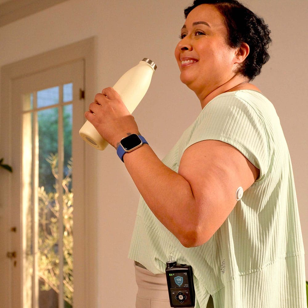 Image of woman with MiniMed products