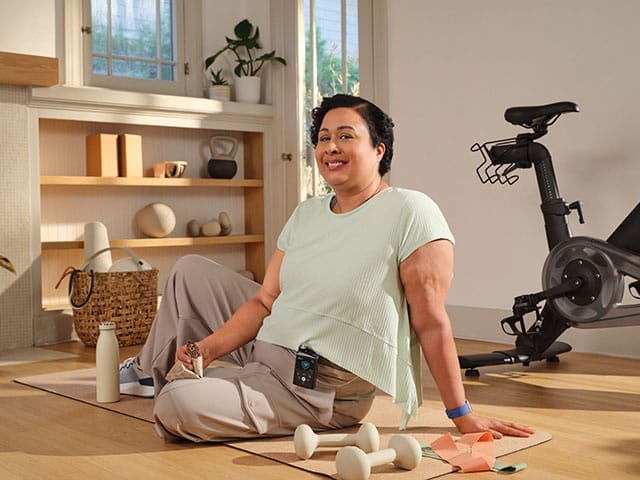 Woman on floor with fitness gear