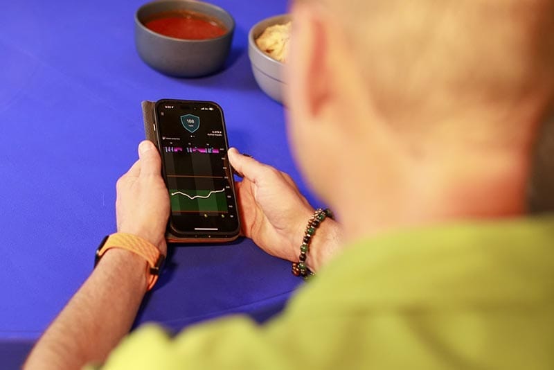 Person using MiniMed Mobile app