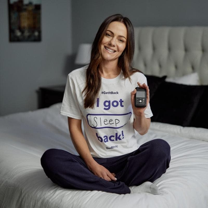 Alexandra Park sitting on a bed with insulin pump