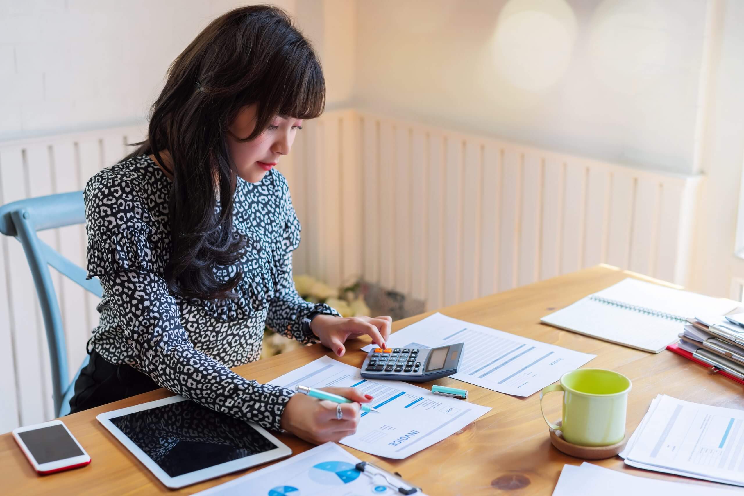 Woman calculating taxes