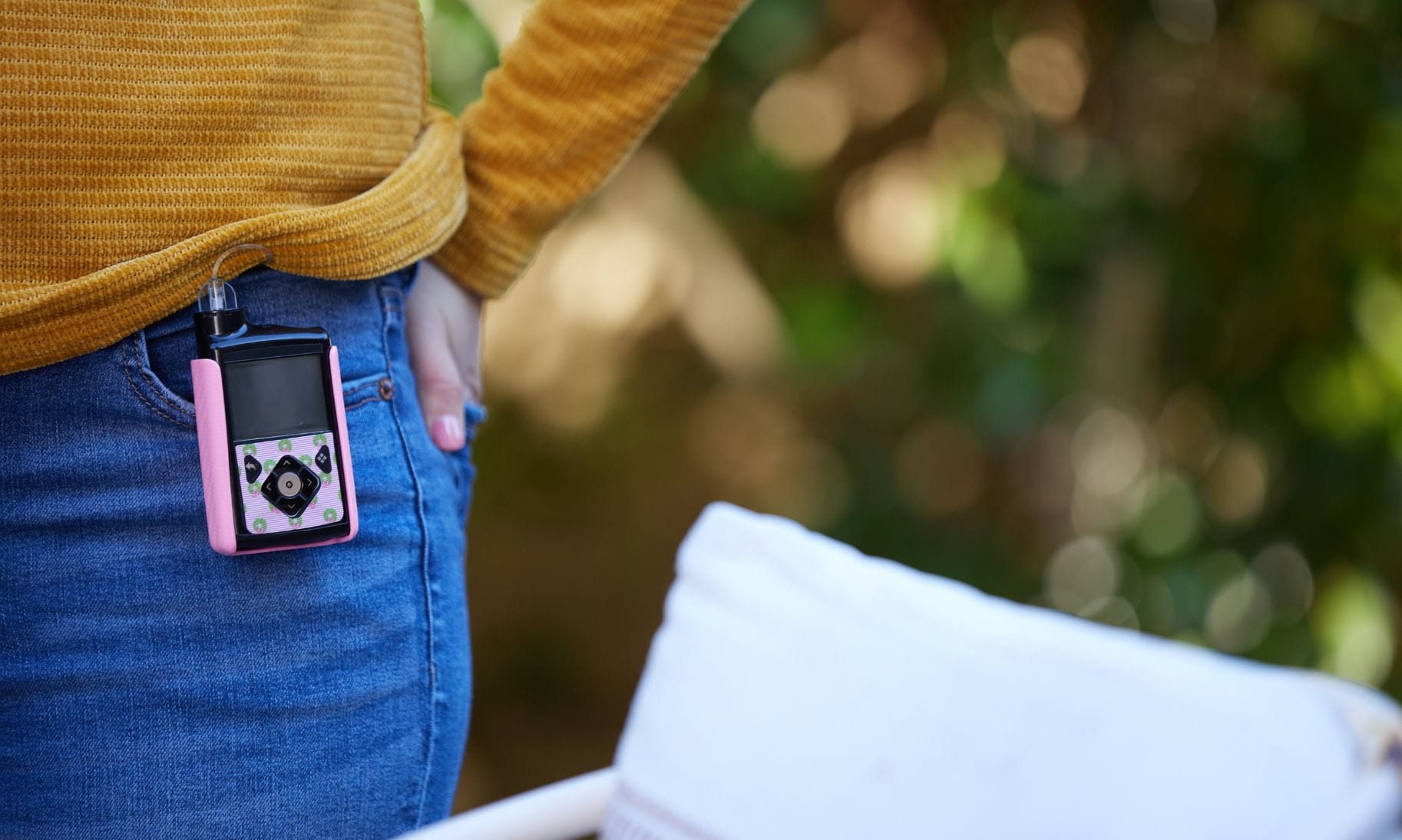 woman wearing insulin pump on jeans