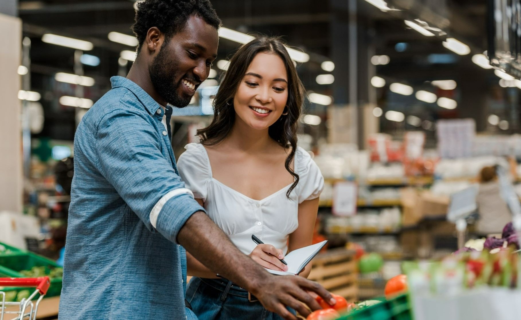 Couple grocery shopping together