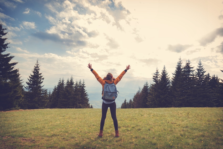 Woman with open arms in outdoor