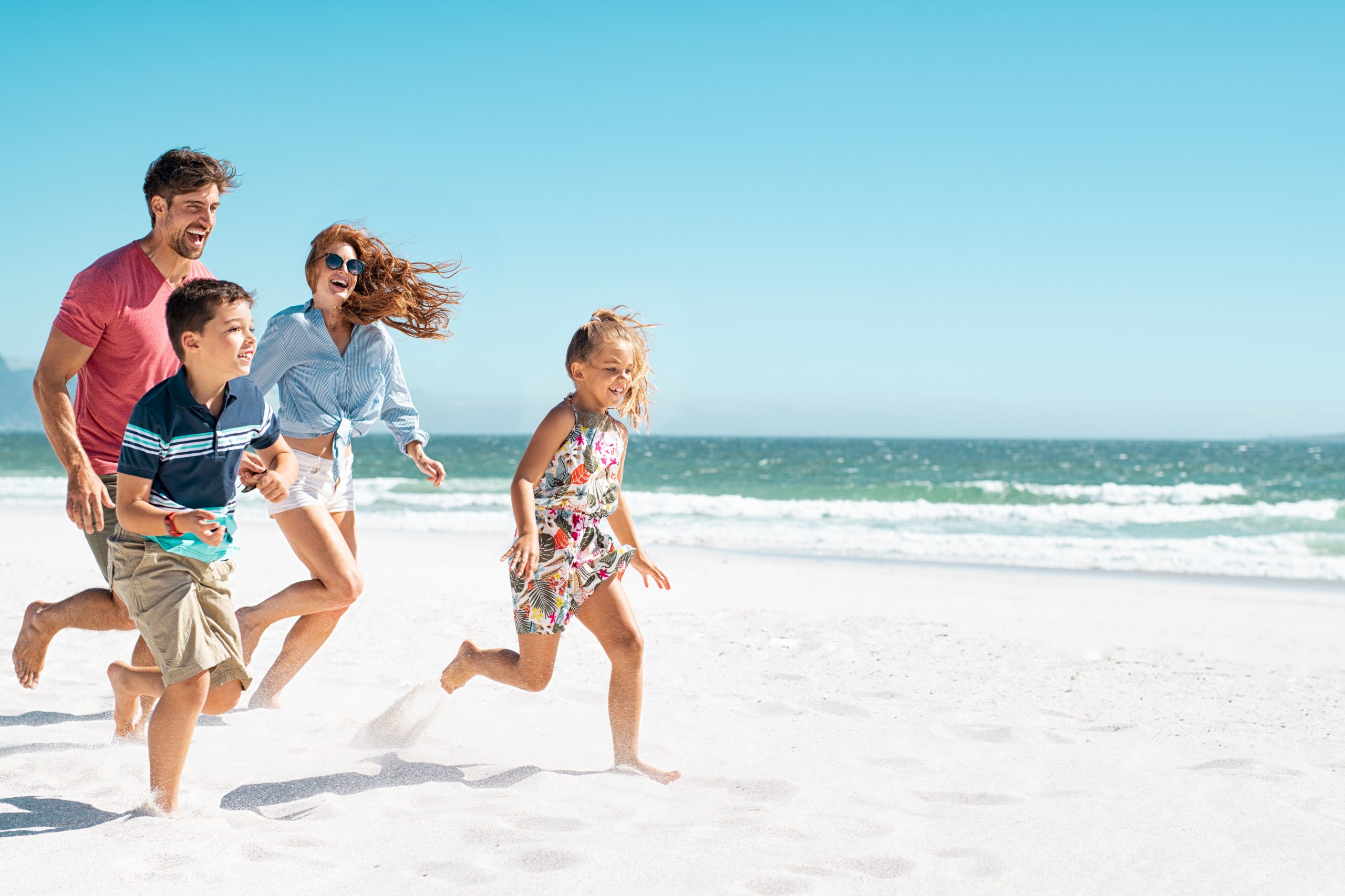 Family playing at the beach