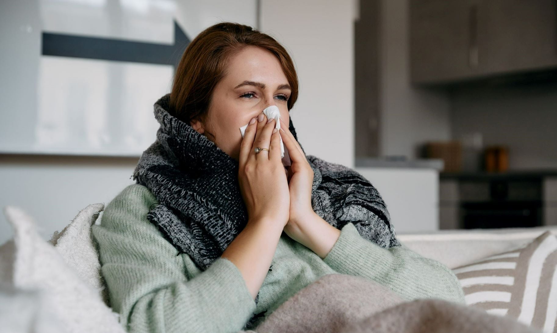 Woman blowing her nose