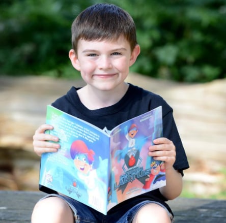 Boy holding Captain Lantus comic book