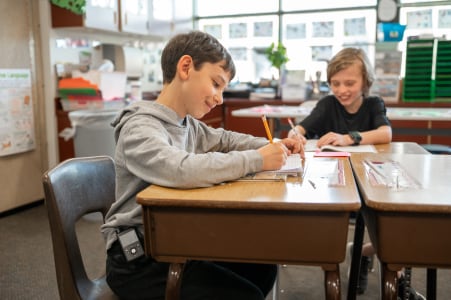 Child in school wearing an insulin pump